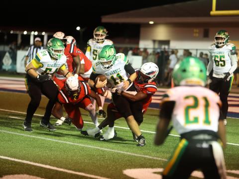 Suwannee quarterback Haigen Johnson is tackled by a Wakulla defender on Friday. (PAUL BUCHANAN/Lake City Reporter)