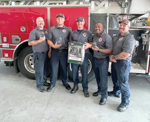 Lake City firefighters Chris Bethea (from left), Jayden Britton-Drew, Hunter Anderson, Mae Williams and Earl Lupardus, show the new gas monitors that were recently purchased by the fire department with grant funds. (COURTESY)