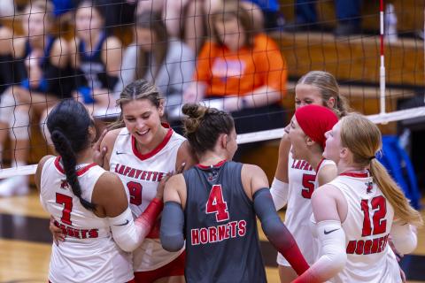 The Lafayette volleyball team celebrates a point against Branford on Aug. 27. (JACK HOWDESHELL/Lake City Reporter)