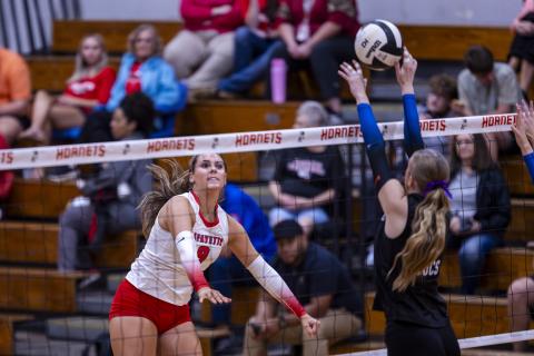 Lafayette middle hitter Sophia Kendrick sends a shot over the net against Branford on Aug. 27. (JACK HOWDESHELL/Lake City Reporter)