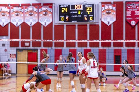 Columbia middle hitter Meleane Wood (3) and her teammates celebrate her block of Lafayette's Sophia Kendrick (9) to earn match point in a sweep of Lafayette on Thursday. (JACK HOWDESHELL/Lake City Reporter)