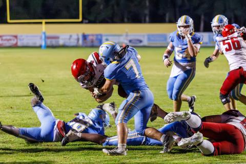 Chiefland linebacker Andrew Thisse stops Lafayette running back Trevor Byrd short of the goal line on the Hornet’s two-point conversion attempt in overtime. (JACK HOWDESHELL/Lake City Reporter)