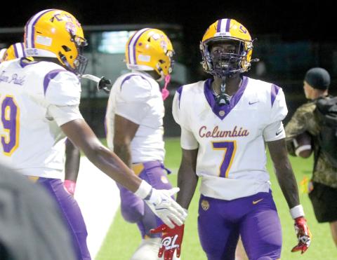Columbia receiver Kyren Caldwell celebrates with teammates on the sideline after catching a touchdown pass against Manatee on Friday. (JORDAN KROEGER/Lake City Reporter)