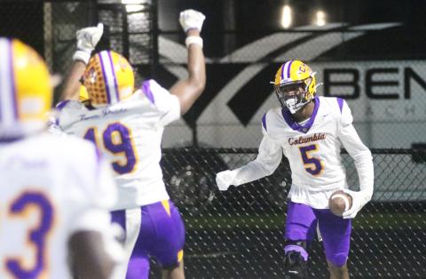 Columbia receiver Legend Camiel (19) runs over to celebrate with receiver Jaylon Willis (5) after Willis a caught touchdown against Manatee on Oct. 2. (JORDAN KROEGER/Lake City Reporter)