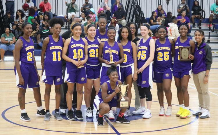 Columbia’s girls basketball team is pictured with the trophy after winning the Hitchcock’s Challenge on Monday. (JORDAN KROEGER/Lake City Reporter)