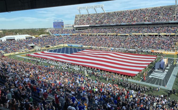 An American flag is stretched across the field at Camping World Stadium for the national anthem at the Pro Bowl on Sunday, in Orlando. (MICHAEL BJORKLUND-MALCOM/Special to the Reporter)
