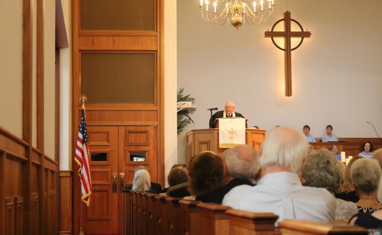 The Rev. Al Reese delivers the eulogy at the celebration of life service held for James H. Montgomery on Saturday at First Presbyterian. (MICHAEL PHILIPS/Special to the Reporter)
