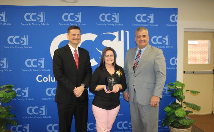 Steve Nelson (from left), Columbia School Board chairman poses with Candace Starling and Lex Carswell, Columbia Schools’ Superintendent after Starling, a CHS secretary, was named the 2020 School-Related Employee of the Year Award winner Thursday. (TONY BRITT/Lake City Reporter)