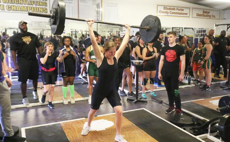 Columbia’s Morgan Hoyle finishes her clean and jerk to break her own school record in the 129-pound weight class with a lift of 145 pounds at the District 2-2A meet on Friday. (JORDAN KROEGER/Lake City Reporter)
