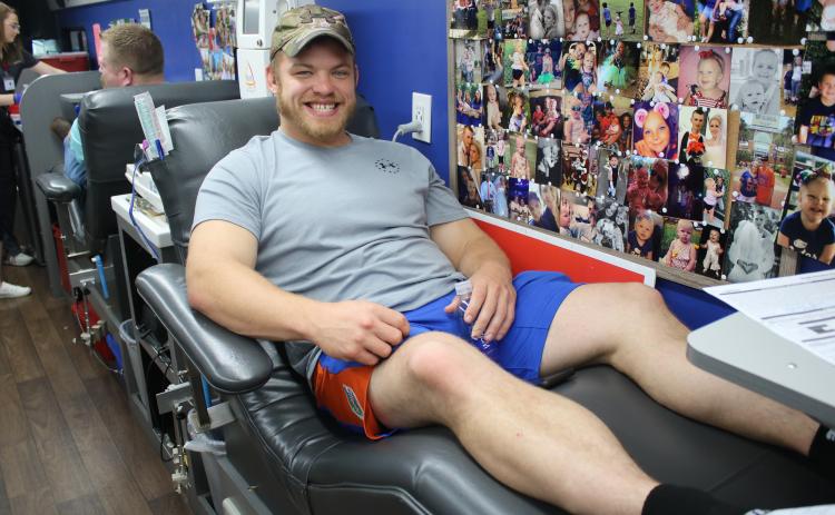 Nick Albrecht takes time off from his job at the Florida Department of Transportation to donate blood at the Lake City Police Department’s “Public Safety Blood Drive” on Friday. (MICHAEL PHILIPS/Lake City Reporter)