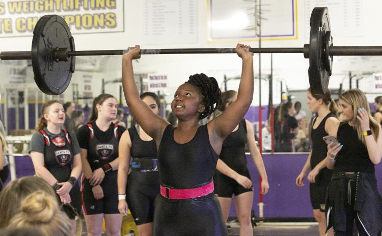 Columbia weightlifter Miracle Rentz-Black finishes her clean and jerk during Thursday’s meet against Santa Fe. (JEN CHASTEEN/Special to the Reporter)