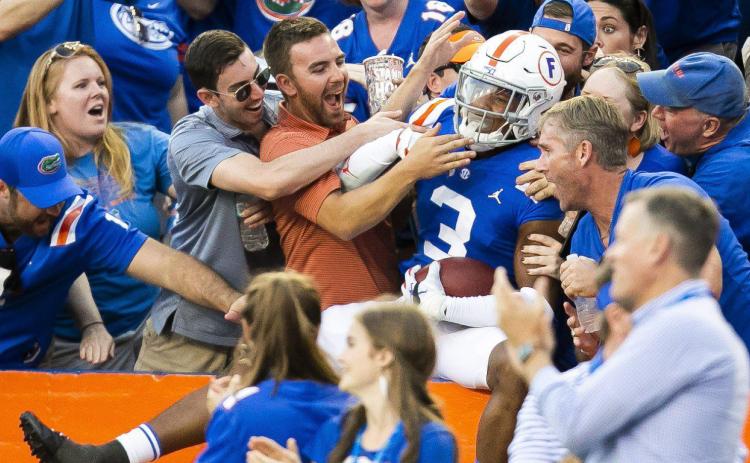 Florida defensive back Marco Wilson (3) celebrates an interception against Auburn in October. Wilson is returning to the Gators for 2020. (TRIBUNE NEWS SERVICE)