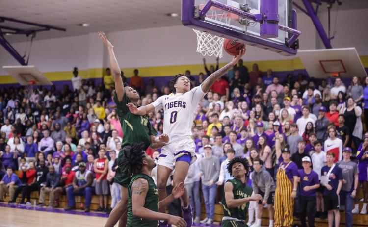Columbia guard Jordan Smith scores a layup after a steal against Lincoln during Tuesday night's Region 1-6A semifinal. (BRENT KUYKENDALL/Lake City Reporter)