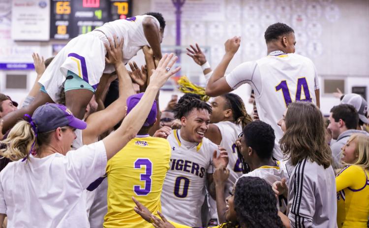 Columbia’s basketball team celebrates with students after defeating Daytona Beach Mainland 70-65 in Friday night’s Region 1-6A final. (BRENT KUYKENDALL/Lake City Reporter)