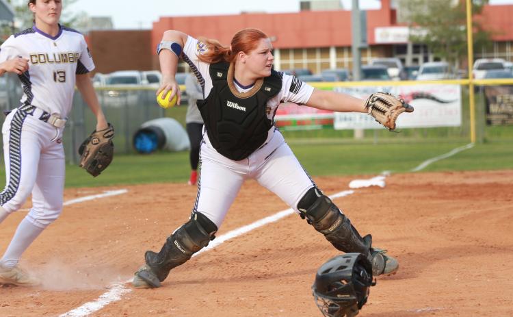 Columbia catcher Reece Chasteen fields a bunt and throws to first base in a game against Middleburg last season. Chasteen, along with third baseman Morgan Hoyle (left) are two of the Lady Tigers’ returning starters this season. (JEN CHASTEEN/Special to the Reporter)