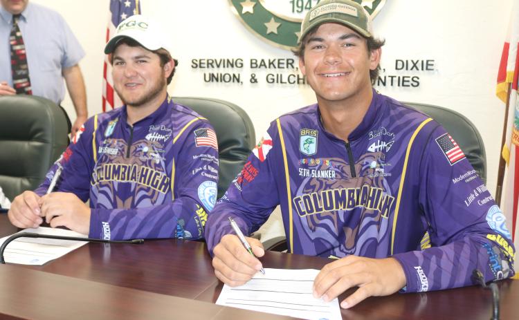 Columbia Bassmasters Jackson Swisher (left) and Seth Slanker (right) signed their letters of intent to compete with Florida Gateway College on Thursday. (TONY BRITT/Lake City Reporter)
