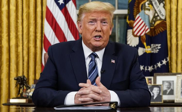 President Donald Trump speaks in an address to the nation from the Oval Office at the White House about the coronavirus Wednesday in Washington. (AP PHOTO)