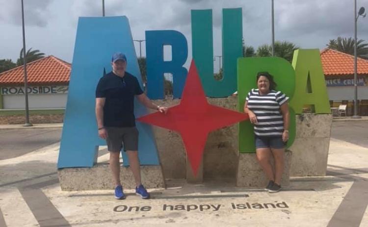 Lake City residents Ovidiu and Sondra Deaconescu pose for a picture in Aruba while on a cruise. Their trip was unexpectedly extended yesterday, when Puerto Rican officials refused to let passengers from the ship disembark. (COURTESY)