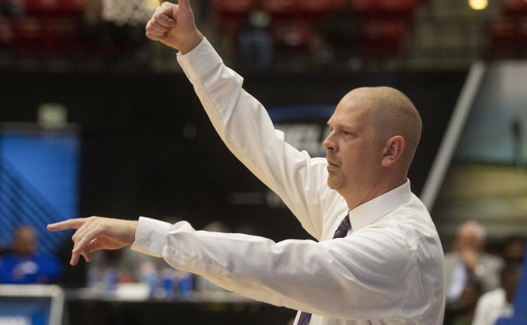 Columbia’s head basketball coach Steve Faulkner instructs his players against Dillard during the Class 6A state semifinals at The RP Funding Center on March 5, in Lakeland. (MICHAEL WILSON/Special to the Reporter)