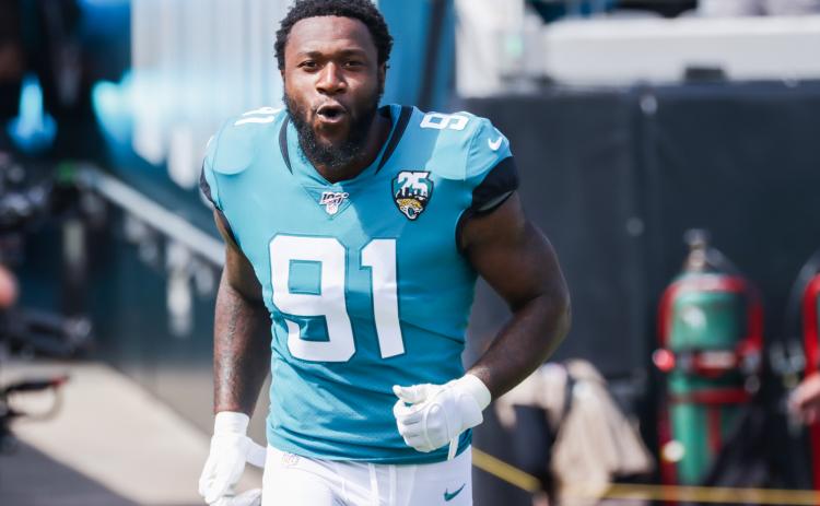 Jacksonville Jaguars defensive end Yannick Ngakoue charges onto the field to face the New Orleans Saints before their game at TIAA Bank Field on Oct. 13, 2019 in Jacksonville. (HARRY AARON/Getty Images/TNS)