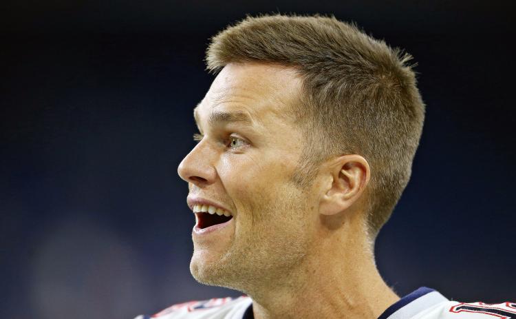 New England Patriots quarterback Tom Brady (12) smiles as he walks off the field before their preseason game against the Detroit Lions at Ford Field in Detroit, on Aug. 8, 2019. (MIKE MULHOLLAND/TNS)