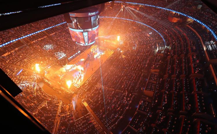 Amway Center is lit up as fans cheer before the start of the Orlando Magic's game against the Cleveland Cavaliers earlier this season. The NBA has suspended play after an athlete tested positive for COVID-19. (STEPHEN M.DOWELL/Orlando Sentinel/TNS)