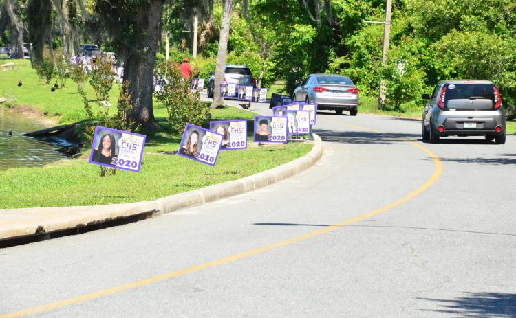 The placards dotted the perimeter of the lake. (CARL MCKINNEY/Lake City Reporter)