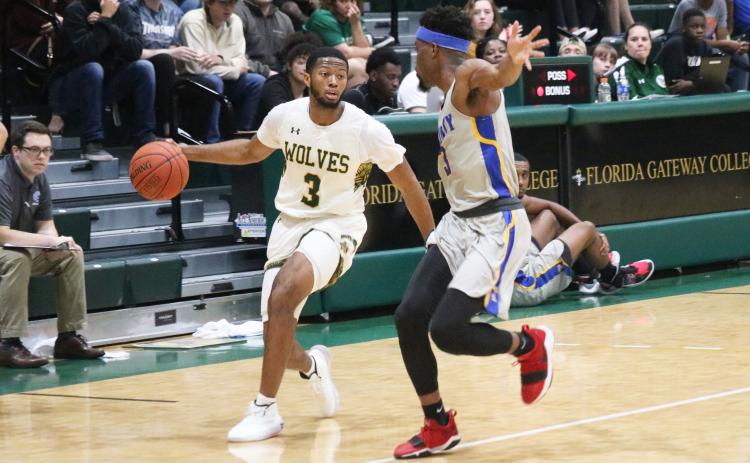 FGC guard Kenny Brown Jr. looks to drive against Trinity Baptist on Jan. 16. (JORDAN KROEGER/Lake City Reporter)