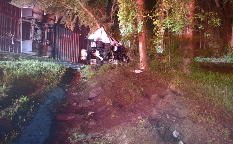 A semi tractor-trailer driven by a St. Cloud man crashed on I-75 in Columbia County early Tuesday morning, killing the driver, the Florida Highway Patrol reported. The man’s name was not released. (COURTESY FHP)