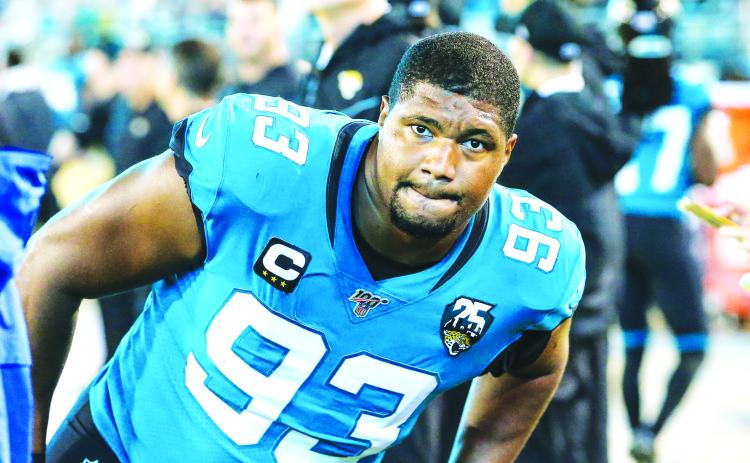 Jacksonville Jaguars defensive end Calais Campbell (93) stretches before against the Tennessee Titans at TIAA Bank Field last season, in Jacksonville. (TRIBUNE NEWS SERVICE)