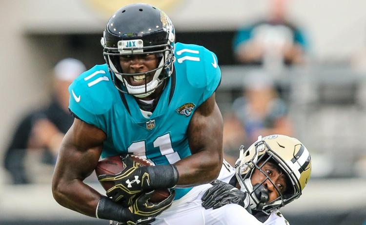 Jacksonville Jaguars wide receiver Marqise Lee (11) catches a pass defended by New Orleans Saints defensive back Patrick Robinson during the first quarter of an NFL preseason football game at TIAA Bank Field on Aug. 9, 2018, in Jacksonville. (TRIBUNE NEWS SERVICE)