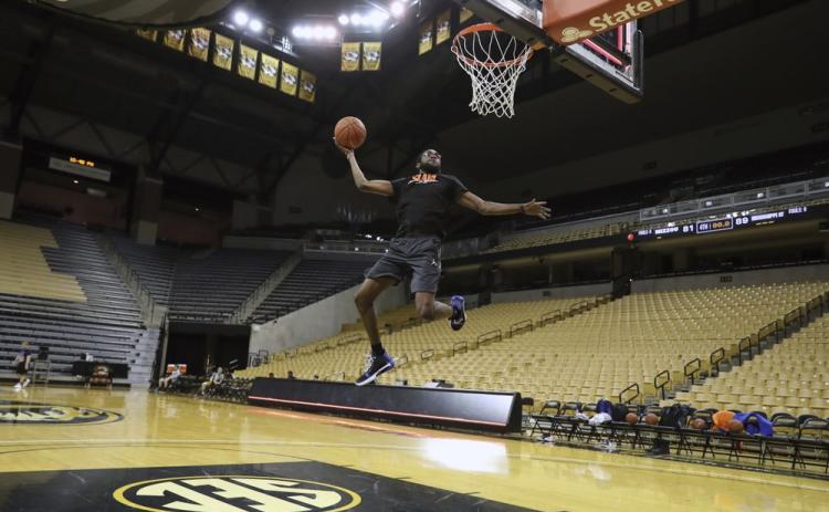 Florida team manager Chris Sutherland is shown warming up before a game between Florida team managers and Missouri team managers, the night before an NCAA college basketball game between Florida and Missouri, at Mizzou Arena in Columbia, Mo. Sutherland waited nearly five years to finally play college basketball. (ALEX DE LA OSA/UAA Communications)