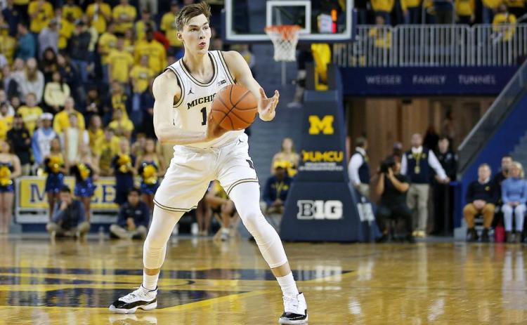 Michigan sophomore Colin Castleton is transferring to Florida. (MIKE MULHOLLAND/TNS)