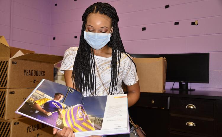 Columbia editor-in-chief Anan-Eya Hardman holds in her hands the culmination of a months-long collaborative effort. (CARL MCKINNEY/Lake City Reporter)