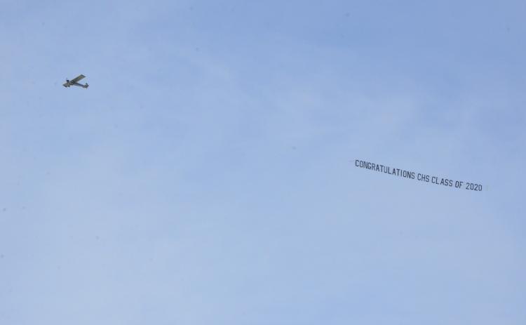 For about an hour Tuesday afternoon, a plane flew over the school, downtown and the U.S. Highway 90 corridor to display the message, “Congratulations CHS Class of 2020.”  The plane flies over CHS before continuing its circuit. The pandemic threw a wrench into seniors’ prom and graduation plans, so the school says it wanted to make a gesture showing the students were not forgotten. (CARL MCKINNEY/Lake City Reporter)