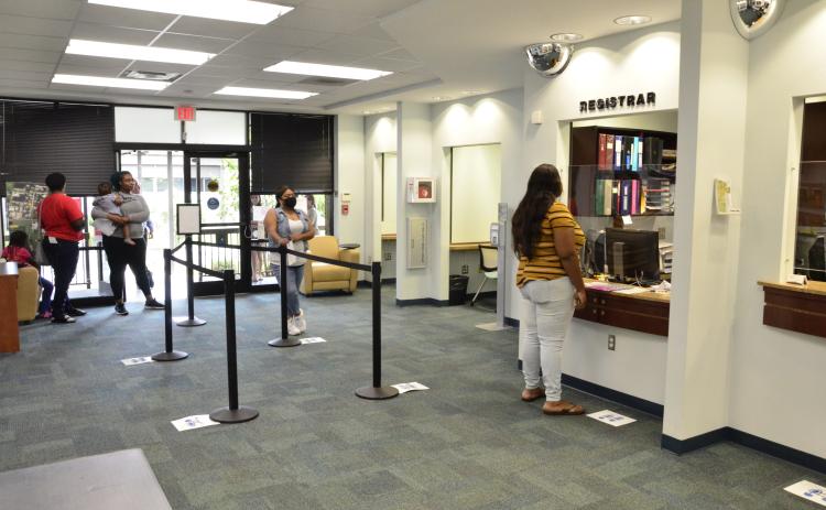Students register for fall classes at Florida Gateway College. The spring graduates haven’t been forgotten, as the college is planning a gauntlet of small-scale ceremonies to give everyone their chance to walk. (CARL MCKINNEY/Lake City Reporter)
