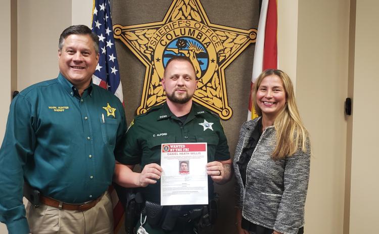 From left are Sheriff Mark Hunter, Deputy Chris Alford and Jacksonville FBI Special Agent In Charge Rachel Rojas. (COURTESY CCSO)