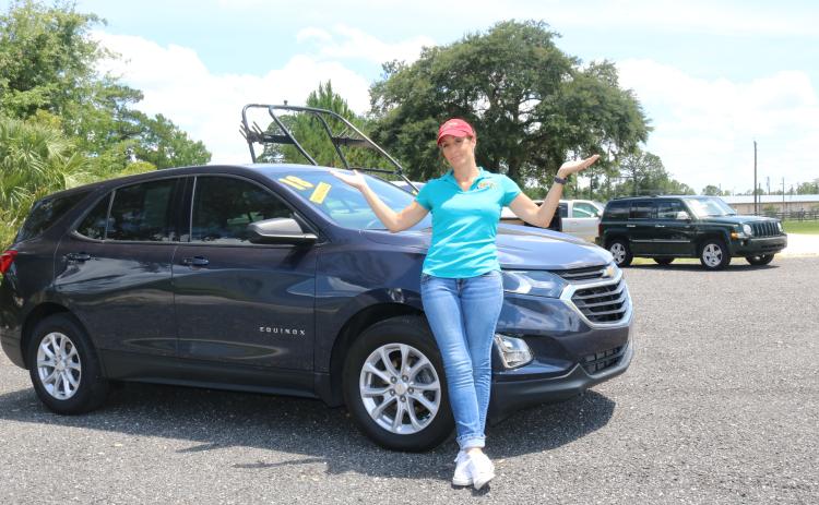 Jennifer Williamson, owner of Right Way Automotive, is down to a handful of vehicles to sell, with little hope of getting more anytime soon. (TONY BRITT/Lake City Reporter)