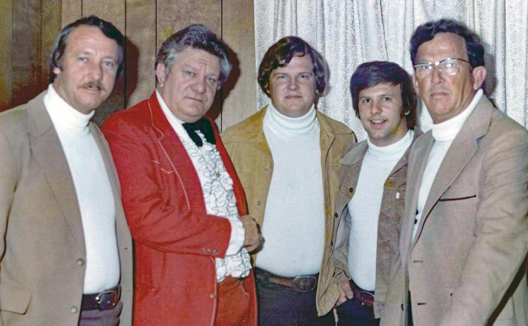 Donald Johns, second from right, meets comedian Jerry Clower during a 1977 performance in Lake City. Donald was at the time part of his cousin’s band, Skip Johns and the Travelers. Skip Johns is pictured at center. (COURTESY)