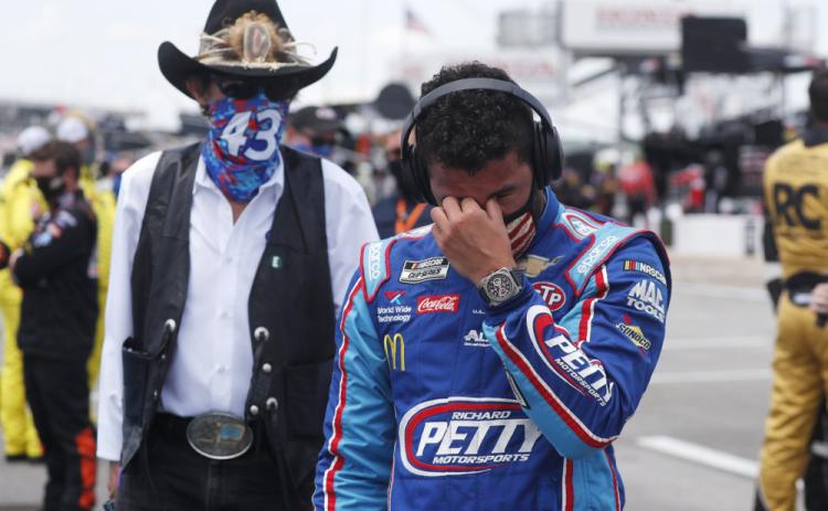 Driver Bubba Wallace, right, is overcome with emotion as he and team owner Richard Petty walk to his car in the pits of the Talladega Superspeedway prior to the start of the NASCAR Cup Series auto race at the Talladega Superspeedway on Monday, in Talladega Ala. (JOHN BAZEMORE/AP Photo)
