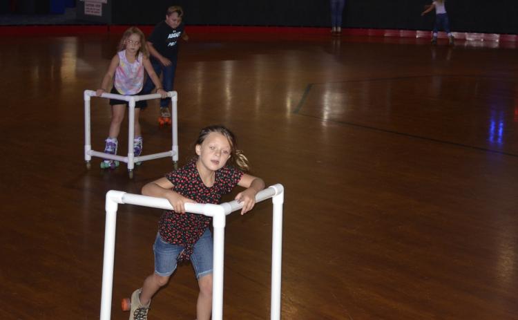 Children skate during a daycare field trip to Skating Palace on Tuesday afternoon. The local skating rink says business is starting to ramp back up, and expects to see an increased volume of customers next week. (CARL MCKINNEY/Lake City Reporter)