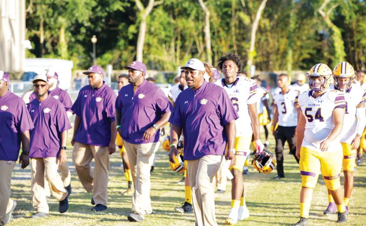 Columbia coach Brian Allen leads his team onto the field prior to last season’s game against Oakleaf. (FILE)