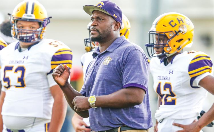 Columbia coach Brian Allen signals in a play against Oakleaf last season. (FILE)
