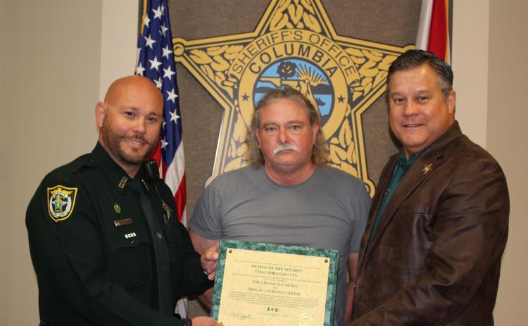 Deputy Anthony Cortese, left, is seen with Jim Osburn and Sheriff Mark Hunter. (COURTESY)