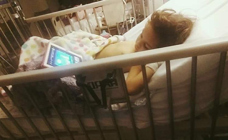 Three-year-old Bristol Risner recovers in the hospital after a disfiguring lawnmower accident. The young girl’s left foot had to be amputated on Wednesday, but the family is thankful she’s alive. (COURTESY)