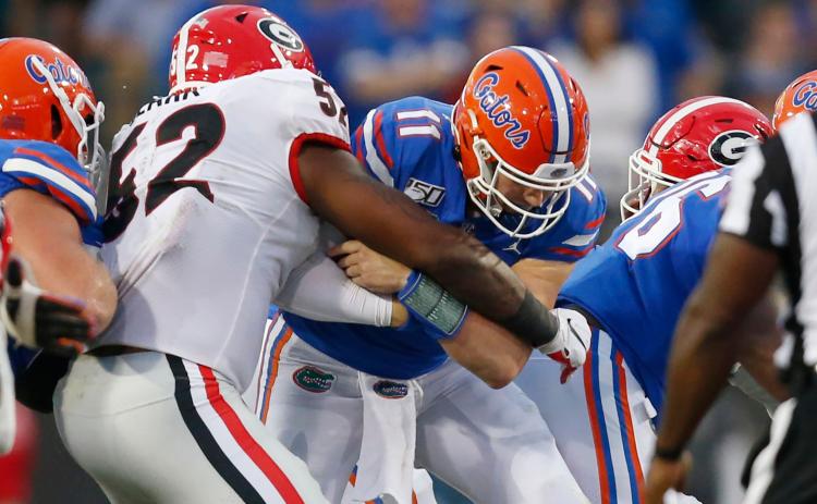Florida quarterback Kyle Trask is sacked in last year's game against Georgia. (TAMPA BAY TIMES/TNS)