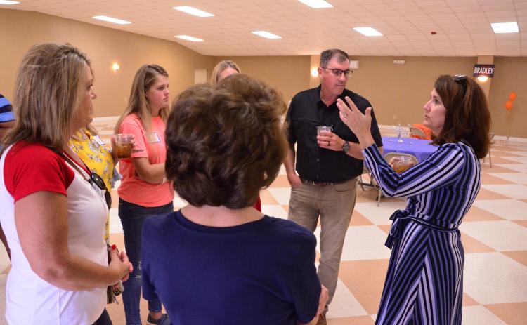 State Senate candidate Jennifer Bradley chats with a group during a meet and greet at the Columbia County Fairgrounds on Thursday. Bradley, a Republican, is running for the District 5 Senate seat held by her soon-to-be term-limited husband. (CARL MCKINNEY/Lake City Reporter)