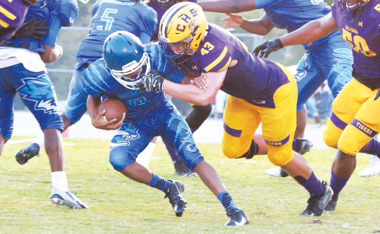 Columbia defensive end Jaiden Tillotson makes a tackle against AA Christian last season. (FILE)