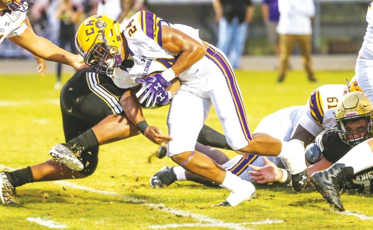Columbia running back Jailen Brown (24) runs through a tackle against Oakleaf on Aug. 30, 2019. (GARY LLOYD MCCULLOUGH/Special to the Reporter)
