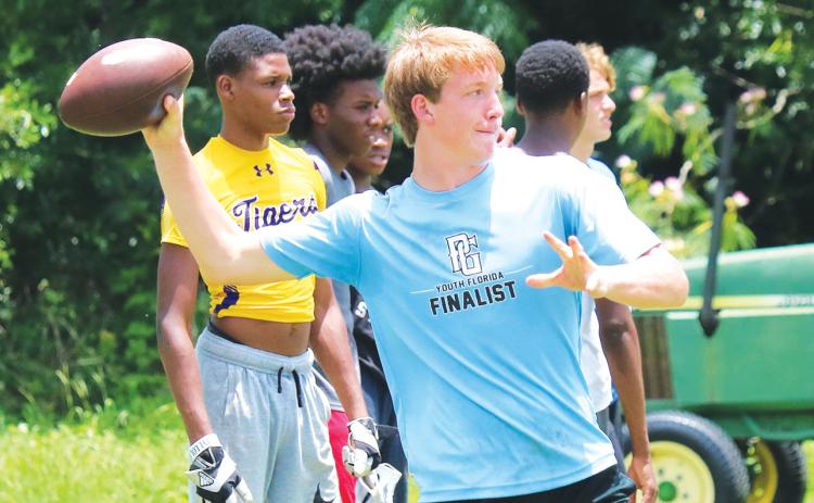 Columbia quarterback Kade Jackson throws during conditioning last summer. (FILE)